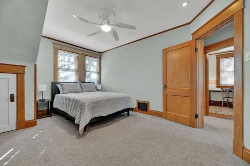 a bedroom with a bed and a ceiling fan at Oakley Square 3BR Charmer - Total Walkability home in Cincinnati
