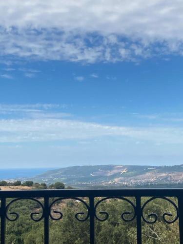 a view of the ocean from a balcony at Benichuta in Mitzpe Hila