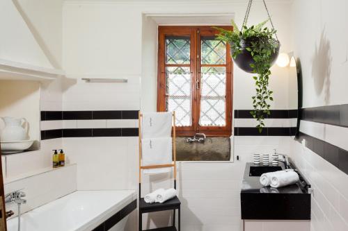 a kitchen with black and white stripes and a stove at Villa Erifili by Pelion Esties in Agios Georgios Nilias