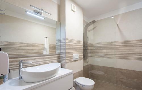 a bathroom with a sink and a toilet at Villas Alfa & Omega in Klis
