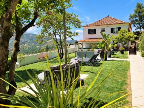 a view from the garden of a house at Quinta da Palmeira - Country House Retreat & Spa in Cerdeira