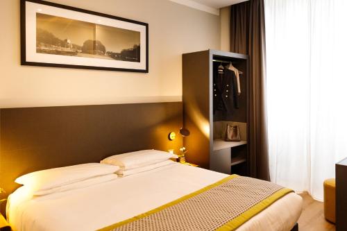 Ένα ή περισσότερα κρεβάτια σε δωμάτιο στο The Cross Hotel
