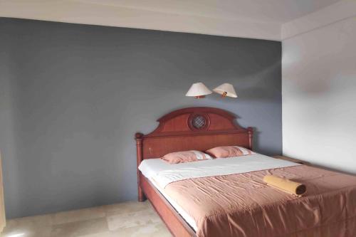 Katil atau katil-katil dalam bilik di Pecatu GuestHouse