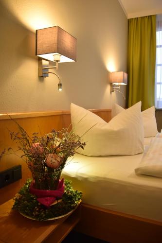 Ένα ή περισσότερα κρεβάτια σε δωμάτιο στο Flair Hotel Kamenz