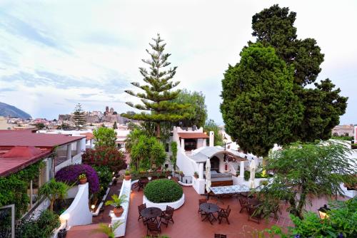 a view of the courtyard of a house with a tree at Gattopardo Park Hotel in Lipari