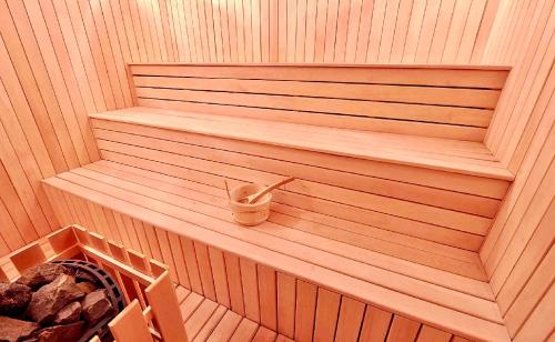 a sauna with a tub and a bucket in it at GVC 4-room 421 New Gudauri in Gudauri