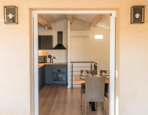 a kitchen with a table and a dining room at La Palmeraie Galli - Duplex de Charme in Sanary-sur-Mer