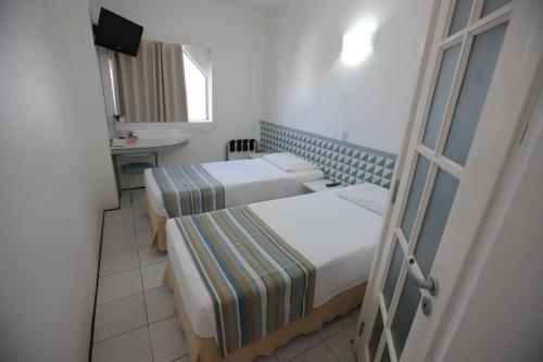Una cama o camas en una habitación de Ibis Budget Salvador