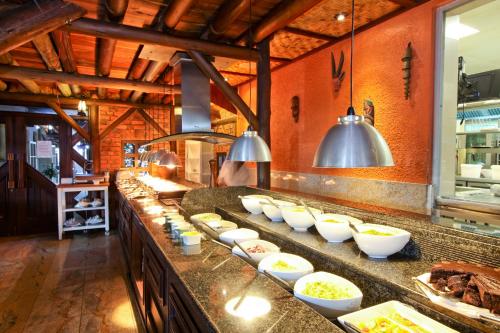 a kitchen with bowls of food on a counter at Roof of Africa Hotel in Windhoek