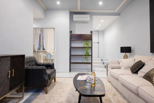a living room with a couch and a table at Divo Apartments - Spanish Steps in Rome