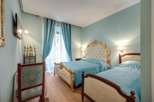Postel nebo postele na pokoji v ubytování La Reggia dei Principi