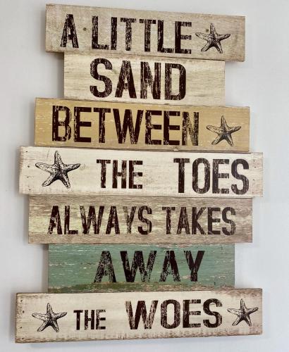 a little sand between the toes always takes the way wood sign at Hillcrest Studio Apartments in Cleethorpes