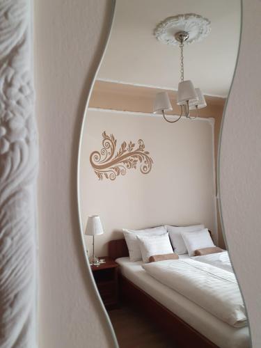Ein Bett oder Betten in einem Zimmer der Unterkunft Duna Panzió