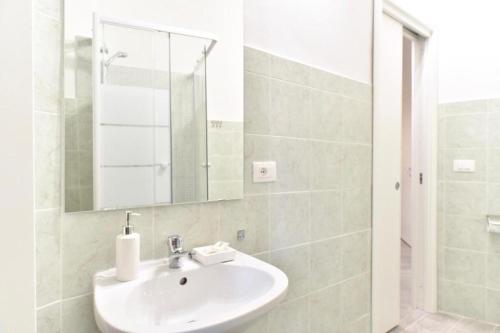 a bathroom with a sink and a mirror at GuestHouse o Affittacamere Magenta Baylon Suite in Rome
