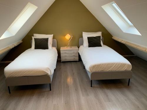 Postel nebo postele na pokoji v ubytování Huize Bronsgroen - vakantiehuis voor 2-6 pers in Limburgse Heuvelland