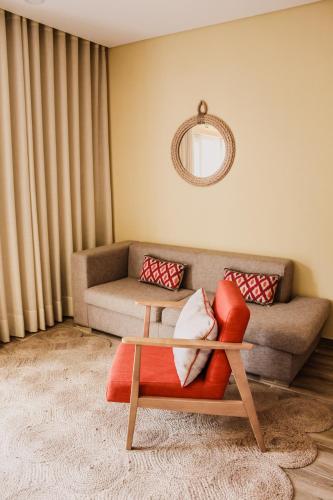 a living room with a couch and a coffee table at Hotel Neptuno in Peniche