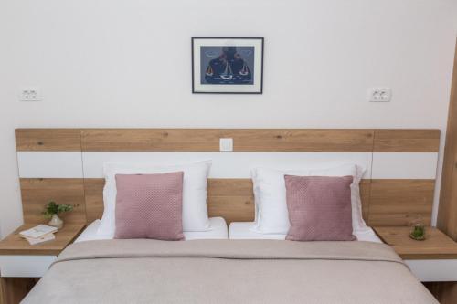 Ένα ή περισσότερα κρεβάτια σε δωμάτιο στο Apartmani Villa Paulo