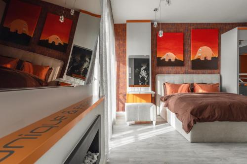 a bedroom with a bed and a fireplace at sky ORANGE jacuzzi sauna 28 FLOOR in Klaipėda
