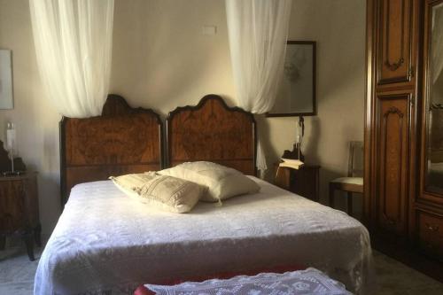 a bedroom with a bed with two pillows on it at La montagna incantata in Isola del Gran Sasso dʼItalia
