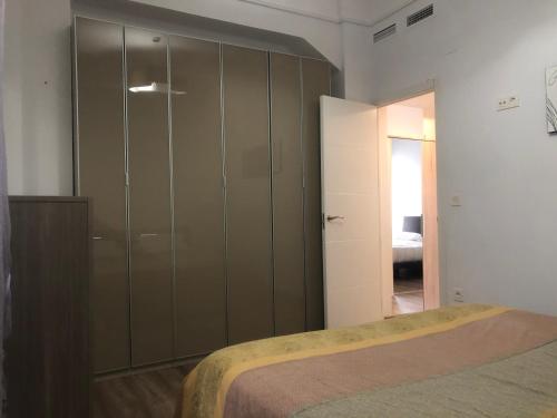 Postel nebo postele na pokoji v ubytování Enjoy Valencia