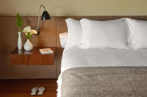 Postel nebo postele na pokoji v ubytování Hotel Fasano Punta del Este