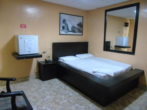 Postel nebo postele na pokoji v ubytování Hotel Imperial