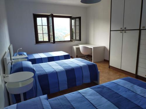 Un pat sau paturi într-o cameră la Sa Stiddiosa Guesthouse