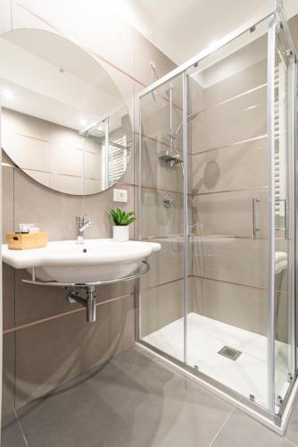 a bathroom with a sink and a shower at Casa Almika Sparano in Bari