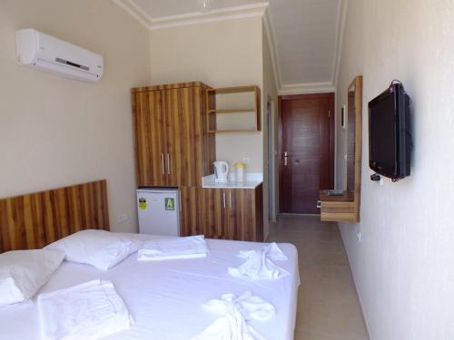 Postel nebo postele na pokoji v ubytování UnSide Apart Otel