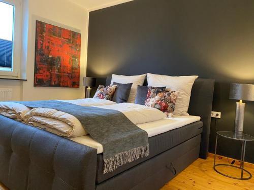 Un pat sau paturi într-o cameră la Ferienhaus AusZeit