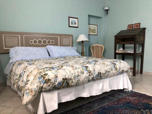 En eller flere senge i et værelse på La Casa di Pietro