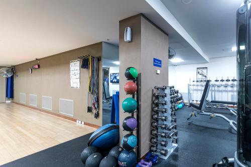 a gym with a bunch of exercise equipment and balloons at RACV Healesville Country Club & Resort in Healesville
