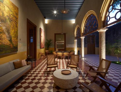 a lobby with chairs and a couch and a table at Hacienda San Antonio Hool in Mérida