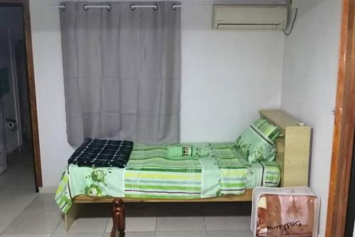 a bed sitting in a room with a window at Solar de Paz 2-Ubicado en pleno Centro-Aparcamient in Rivera