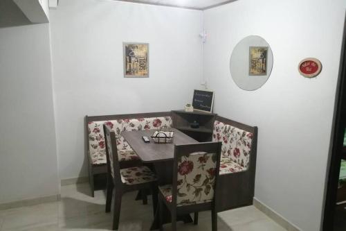 a dining room with a table and two chairs at Solar de Paz 2-Ubicado en pleno Centro-Aparcamient in Rivera