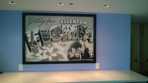 a large picture on a wall in a room at Super 8 by Wyndham Ellenton Bradenton Area in Ellenton