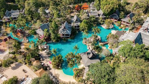an aerial view of the water park at the disneyland resort at Thavorn Beach Village Resort & Spa Phuket in Kamala Beach