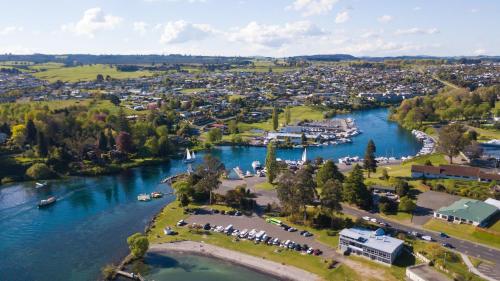 an aerial view of a town next to a river at Alpine Lake Motel in Taupo