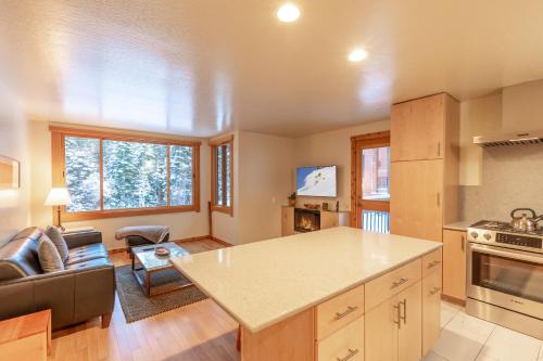 a kitchen and living room with a couch and a table at Modern 1 bedroom in Ski Trails condo in Kingswood Estates