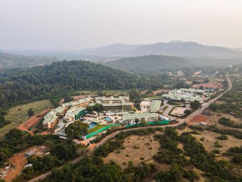 an aerial view of a village in the hills at Club Mahindra Assonora in Assonora