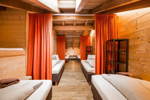 Postel nebo postele na pokoji v ubytování Rutsche Hostel