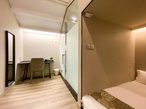 a small room with a bed and a desk at ST Signature Jalan Besar, DAYUSE, 5 Hours, 5PM-10PM in Singapore