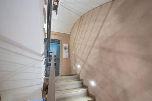 a staircase in a house with wooden walls at Le PALME in Parma