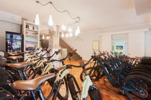 a bunch of bikes parked in a room at Bike&Boat Argentario Hotel in Porto Santo Stefano