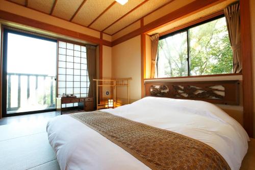 Кровать или кровати в номере Kira No Sato