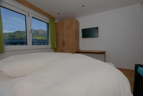 A bed or beds in a room at Mounira Ladis