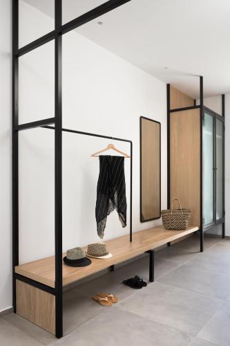 a dressing room with a table and a mirror at Mykonos Soul Luxury Suites in Agios Stefanos