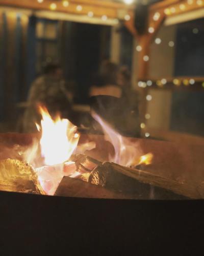 a fire is burning in a brick oven at The Aberlour Hotel in Aberlour