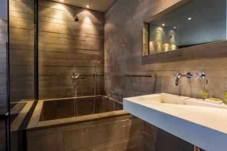 a bathroom with a sink and a bath tub at CMG - Deluxe Tour Eiffel - 22 in Paris