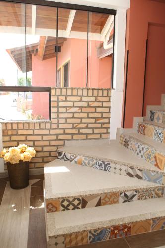 a building with colorful tiles on the stairs at Hotel Açoriano in Penha